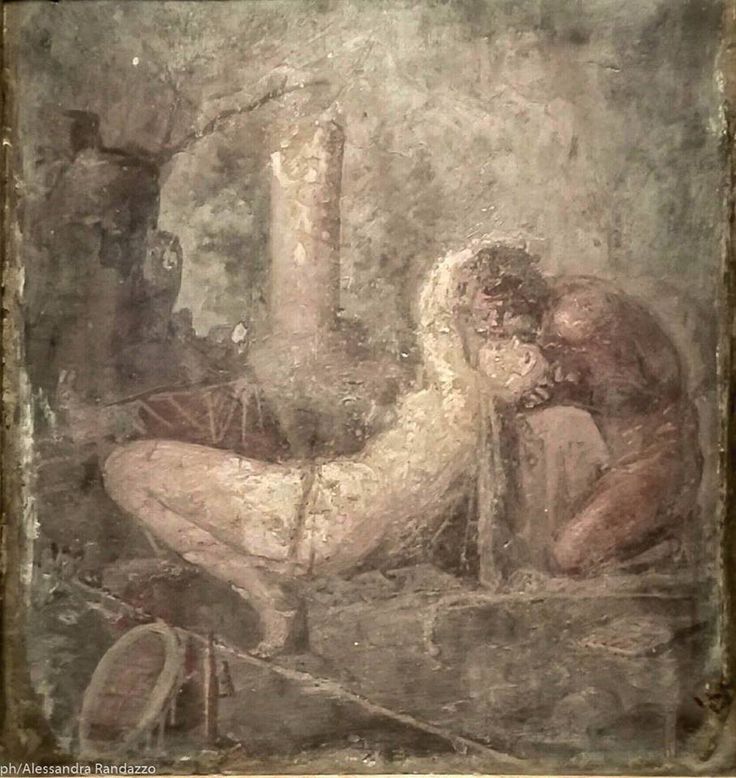 a painting on the side of a wall depicting two men and a woman in ancient greek art