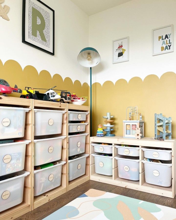 a child's playroom with toy bins and toys