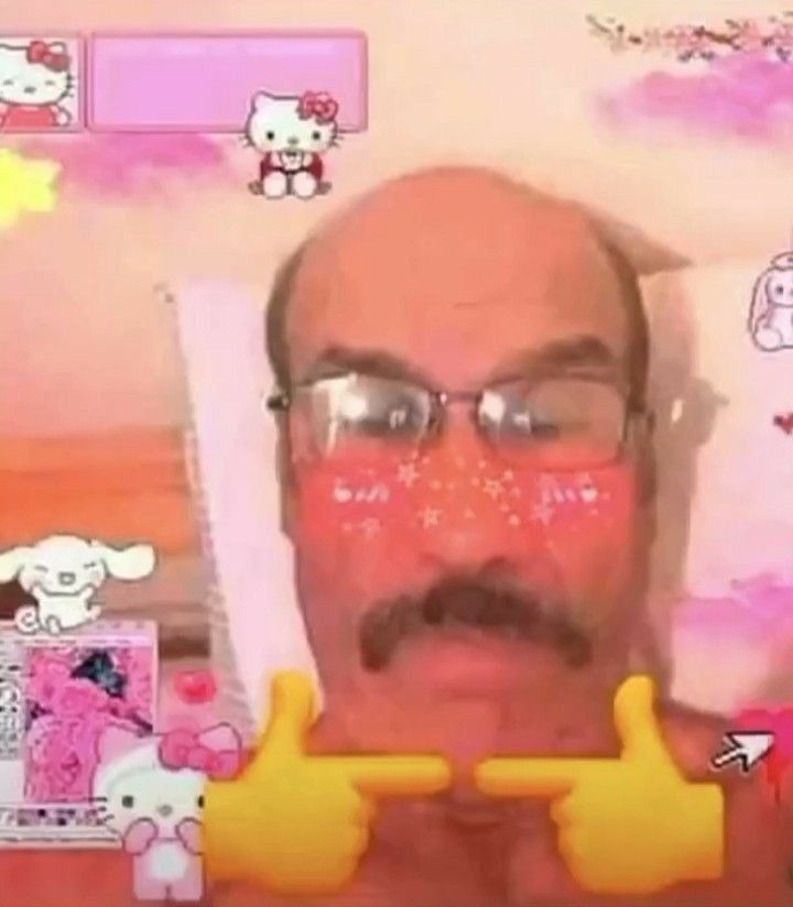 an old man wearing glasses and holding two thumbs up in front of his face with hello kitty stickers on the wall behind him