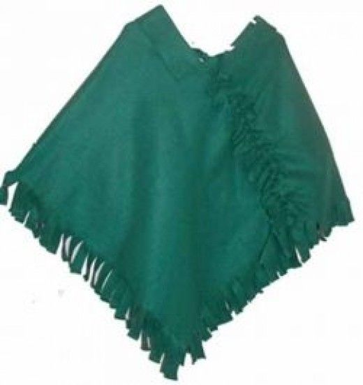 a green ponchy with fringes on it