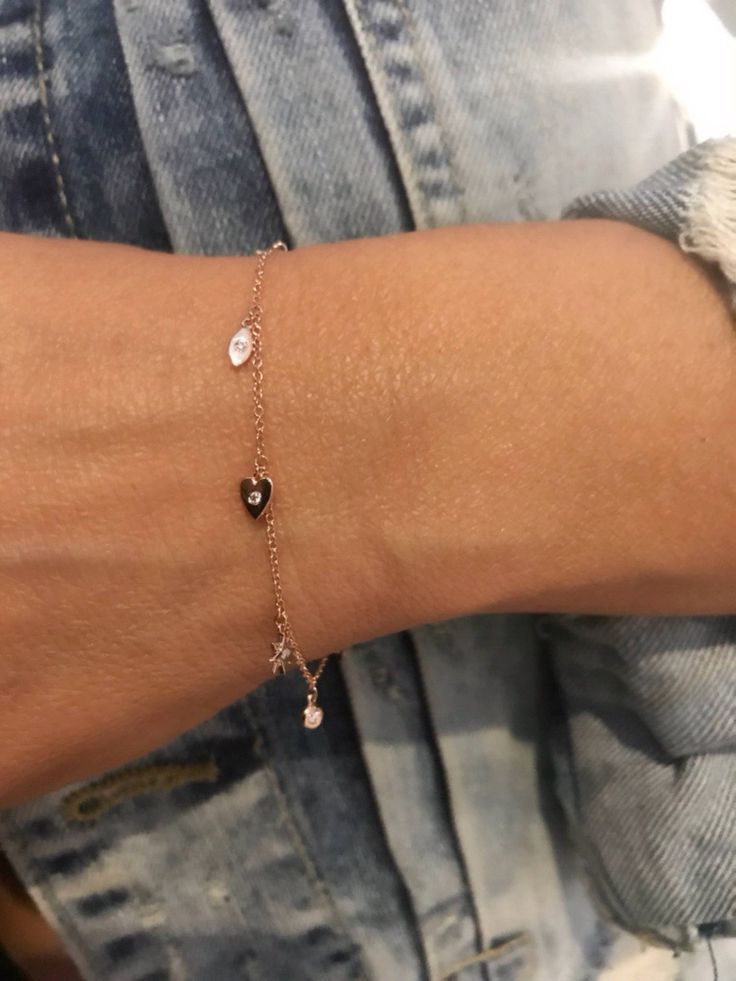 "This dainty yet sturdy charming charm bracelet is the perfect bracelet to layer with other bracelets or just to wear by itself. * 14K Yellow Gold * Approx. Diamond Weight: 0.07cts * Adjustable length: 6\"-7\" *Necklace also available: https://www.etsy.com/listing/510314824/14k-gold-tiny-charm-necklace Upgrades for FedEx/UPS guaranteed 2-day delivery are available and can be selected prior to checkout without separate invoicing. It is generally not an issue, but the USPS cannot guarantee deliver Elegant Dangle Heart Bracelet Gift, Elegant Wedding Charm Bracelet With Heart Charm, Dainty Rose Gold Rosary Bracelet Gift, Dainty Rose Gold Rosary Bracelet, Dainty Charm Bracelet With Removable Charms For Gift, Dainty Heart Charm Jewelry For Promise, Rose Gold Sterling Silver Charm Bracelet For Anniversary, Dainty Charm Bracelet As Gift, Dainty Charm Bracelet With Removable Charms