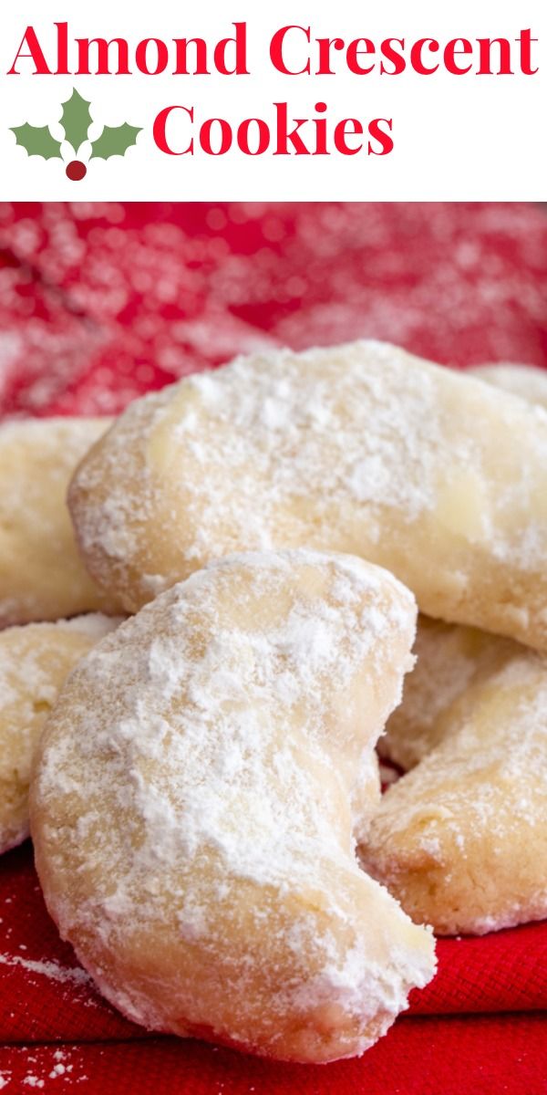 some sugary cookies are on a red cloth with the words, almond crescent cookies