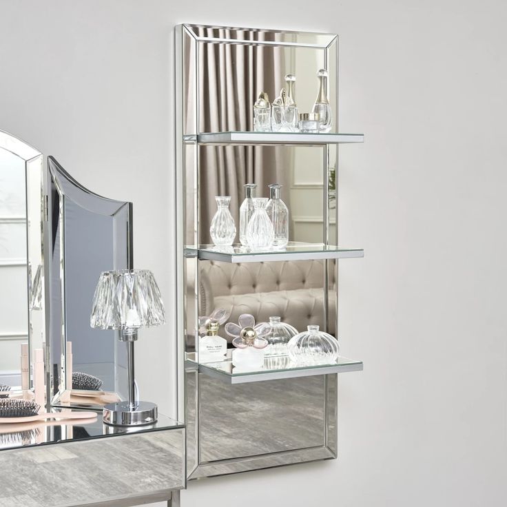 a mirrored shelf with various items on it