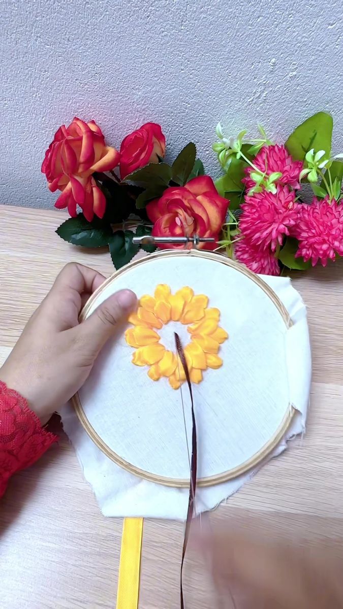 a person is working on a flower project