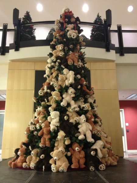 a large christmas tree with lots of teddy bears on it