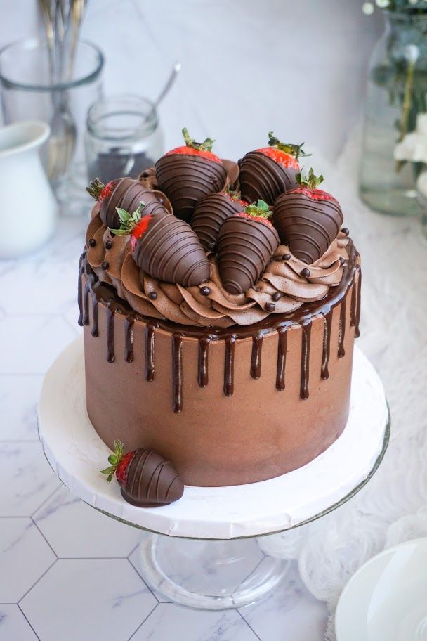 a chocolate cake with strawberries on top