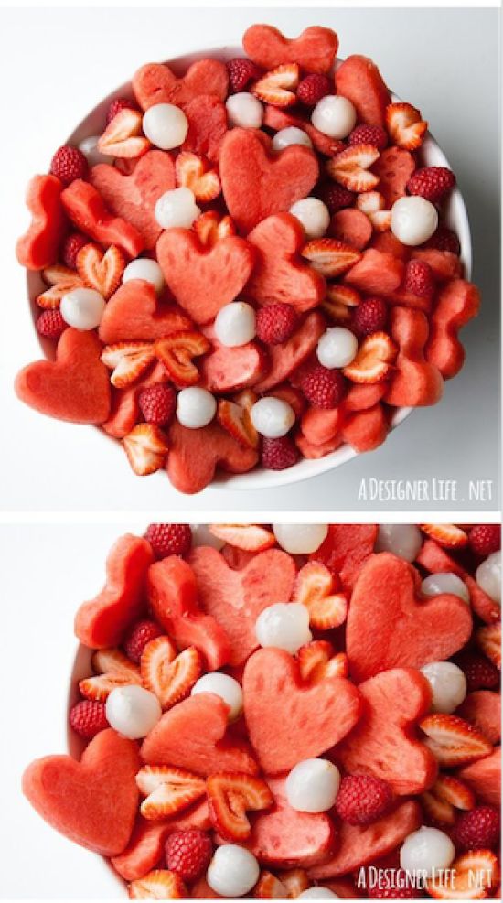 two bowls filled with heart shaped candy and marshmallows on top of each other