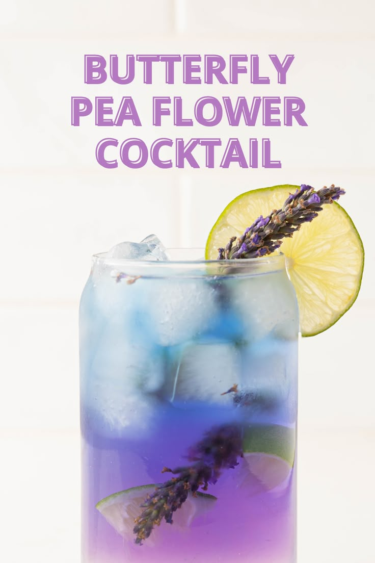 a drink in a glass with lavender and lemon