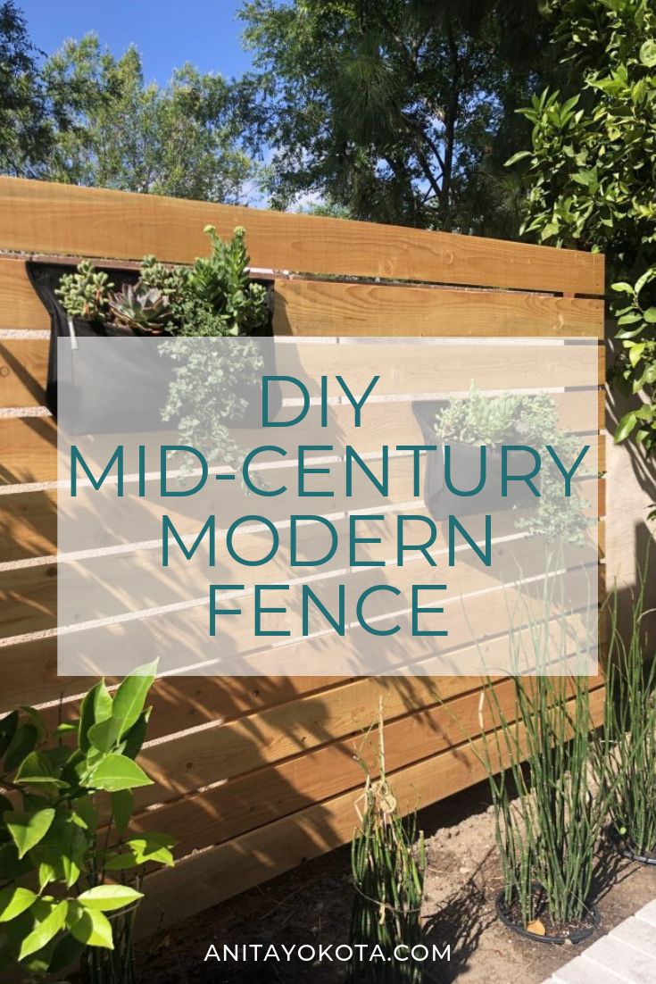 a wooden fence with the words diy mid century modern fence