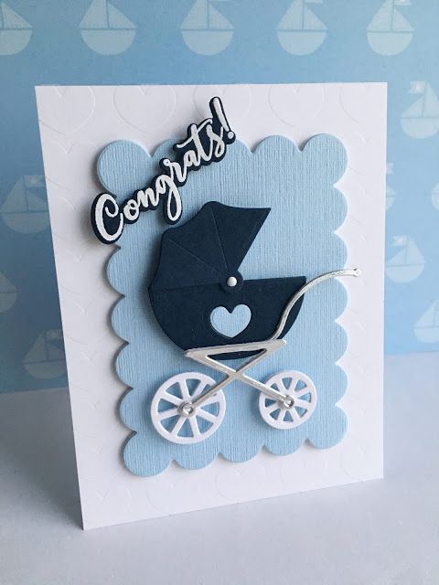 a card with a baby carriage and congratulations written on the front in black, white and blue