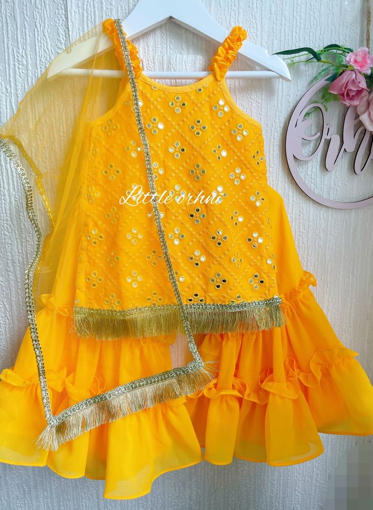 This gorgeous garara set is perfect for any occasion Festive Gold Self Design Palazzo Set, Bollywood Style Yellow Self Design Palazzo Set, Yellow Bollywood Palazzo Set With Self Design, Bollywood Style Yellow Palazzo Set With Self Design, Gold Palazzo Set For Party Festivals, Gold Sharara With Dori Work For Navratri, Festive Gold Sharara With Dori Work, Gold Sets With Dori Work For Diwali, Gold Dori Work Set For Diwali