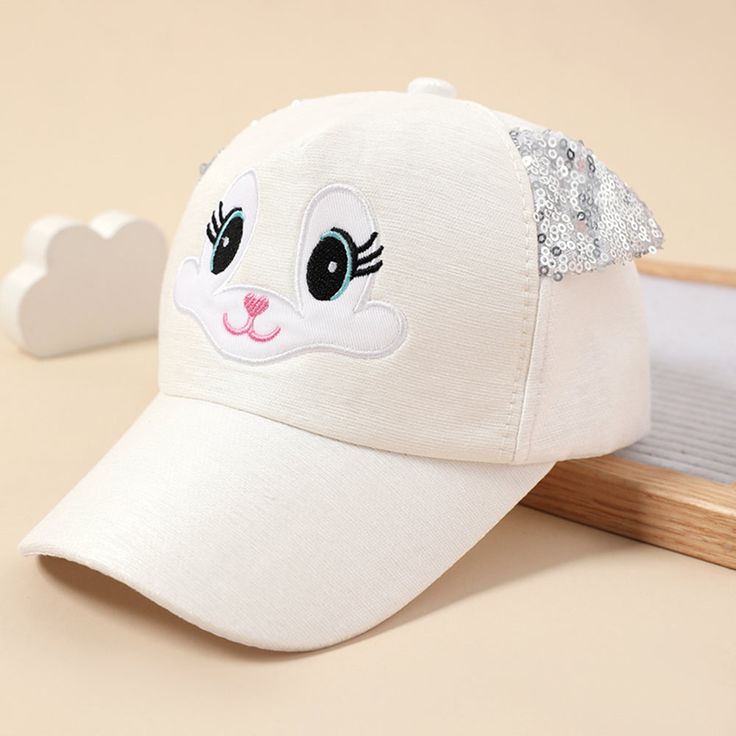 Adorable Summer Cap for Kids with Cartoon Cat Ears Add a dash of cuteness and protection to your little one's sunny adventures with this Cute Cat Ear Adjustable Kids' Baseball Cap. Designed especially for girls aged 2 to 8 years, this cap is crafted with high-quality cotton and polyester for exceptional comfort and durability. Whether your child is heading out for a day at the park or exploring new outdoor activities, this playful cap is the perfect accessory. With its adjustable strap and charm Cute Adjustable Hats With Uv Protection, White Playful Hat With Adjustable Fit, Playful White Hat With Adjustable Fit, Cute Outdoor Baseball Cap - One Size Fits Most, Cute Outdoor Baseball Cap, One Size Fits Most, Cute One Size Fits Most Baseball Cap For Outdoors, Cute White Hats For Outdoor, Cute White Hats With Uv Protection, White Adjustable Kawaii Hat