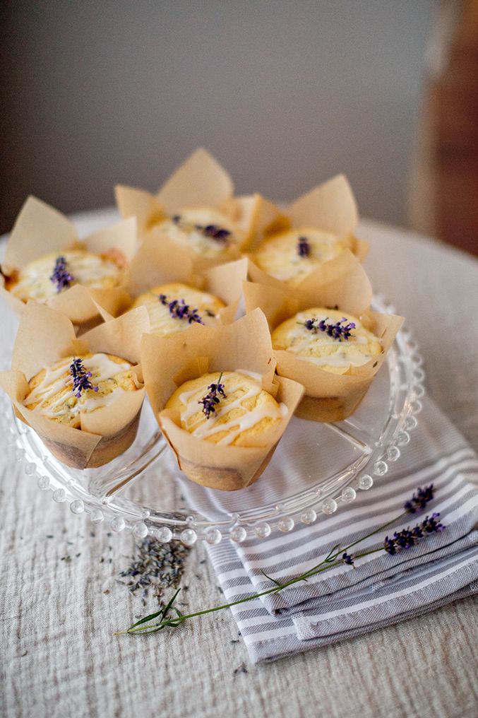 small cupcakes on a glass plate with lavender sprigs