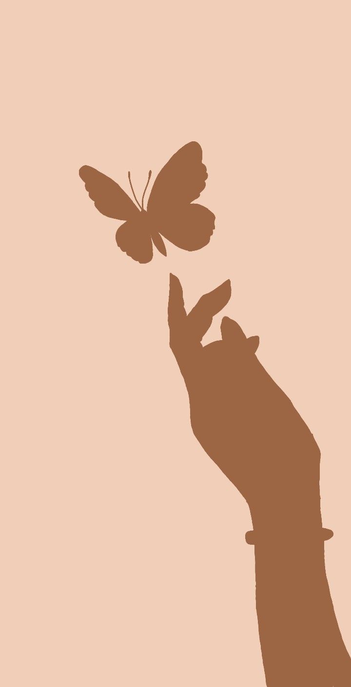 a cat reaching for a butterfly with its paw