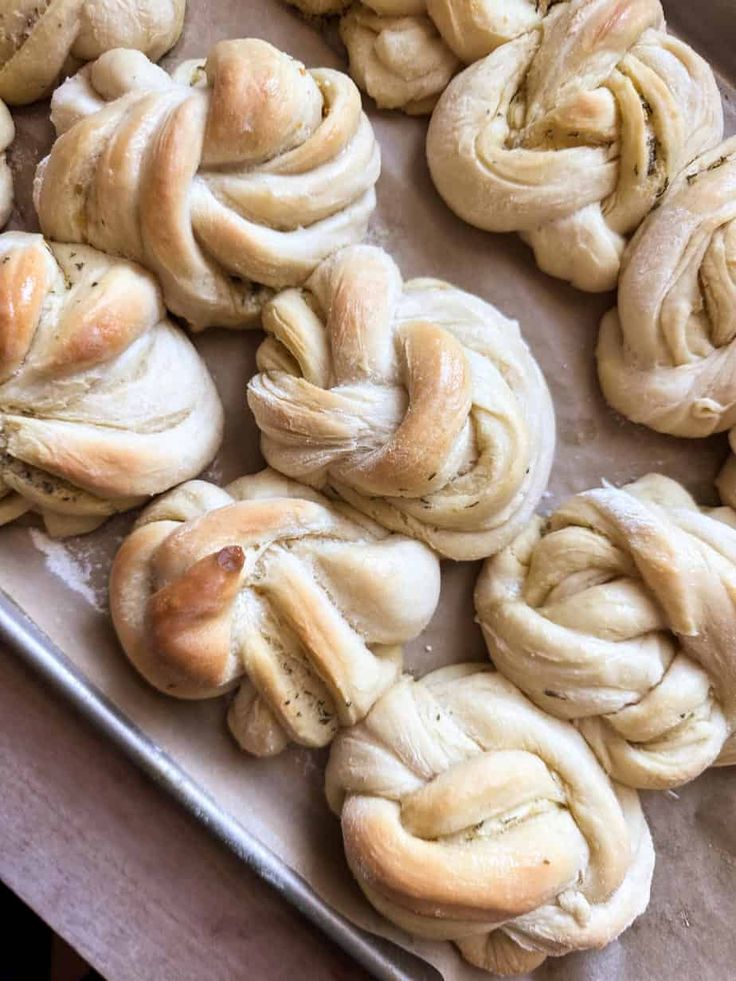 freshly baked rolls on a baking sheet ready to go into the oven