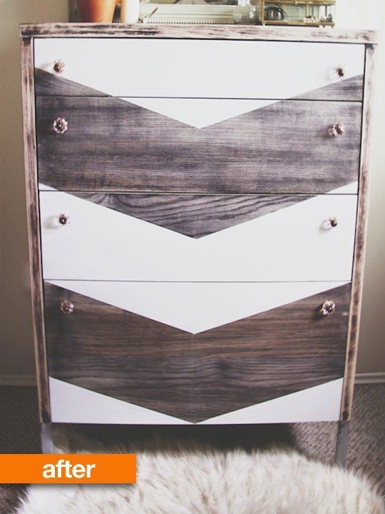 an old dresser has been painted with white and brown chevrons on it's drawers