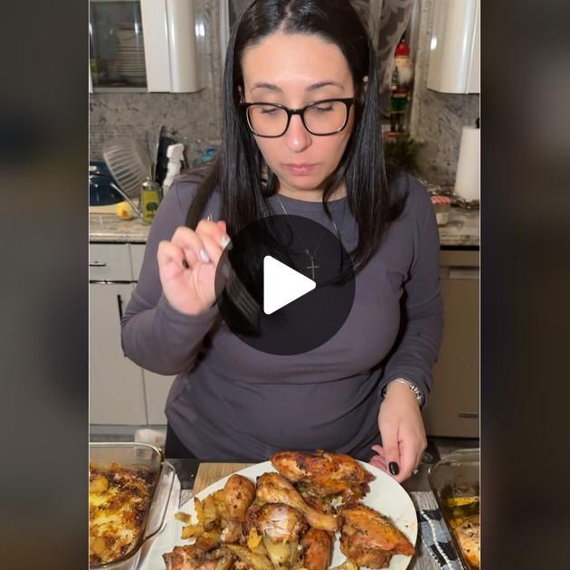 a woman standing in front of a plate of food