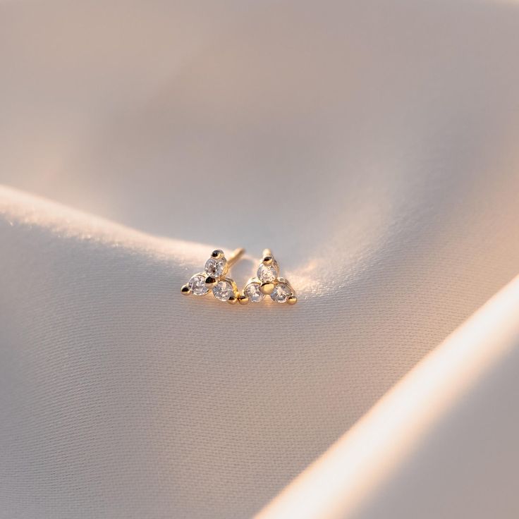 Lily Studs offer a perfect balance of delicate style and subtle sparkle. Crafted from high 18K gold filled and high quality CZs for a timeless look, these mini flower stud earrings will add a finishing touch to any outfit. Flower Stud Earrings, Flower Stud, Flower Earrings Studs, Flower Studs, How To Feel Beautiful, Women Empowerment, Gold Filled, 18k Gold, Lily