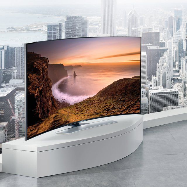 an image of a large screen tv in the middle of a room with cityscape