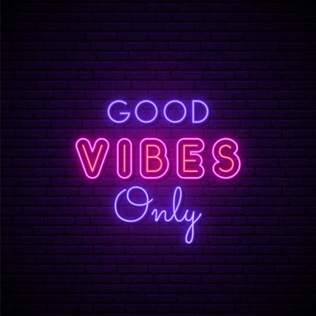 a neon sign that says good vibes only on a dark brick wall with the words,