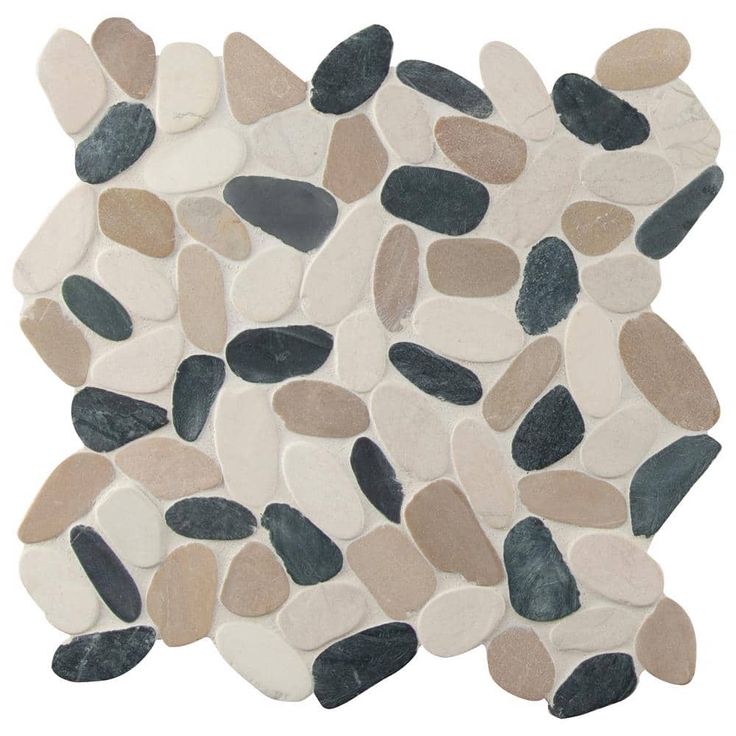 a white and black tile with various colored pebbles on it's side, in the shape of a circle