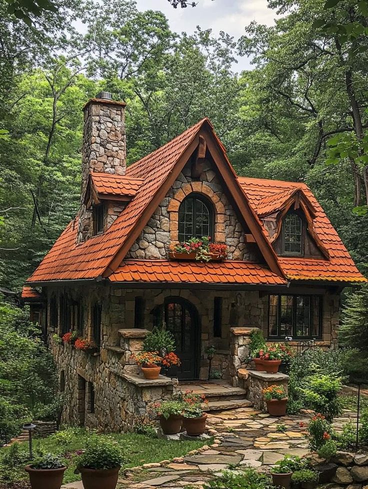 a small stone house in the woods