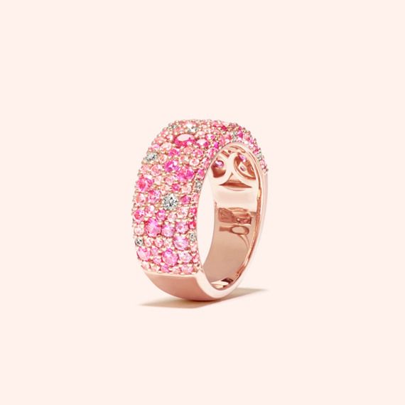 This beautiful ring features a monochromatic mosaic of natural pink sapphires dotted with natural diamond accents to create a bold pop of color. Its vivid 14-karat rose gold perfectly complements all the gemstones. Luxury Multi-stone Pink Sapphire Ring, Luxury Pink Sapphire Ring With Pave Setting, Luxury Pink Sapphire Rings With Single Cut Diamonds, Pink Diamond Ring With Single Cut Diamonds, Pink Diamond Round Band Jewelry, Fine Jewelry Pink Diamond Ring With Round Band, Pink Diamond Ring With Round Band In Fine Jewelry, Luxury Pink Multi-stone Ruby Ring, Pink Diamond Ring With Round Band