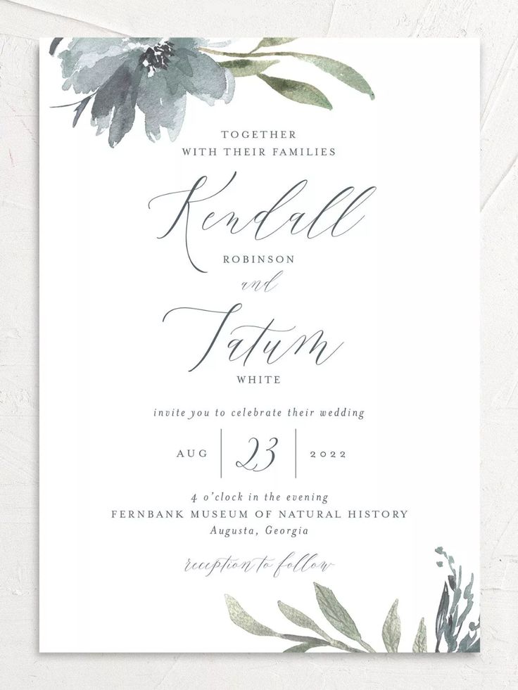 an elegant wedding card with watercolor flowers and greenery on the front, in purple