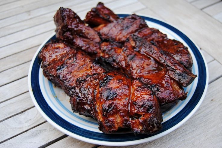 barbecue ribs on a blue and white plate