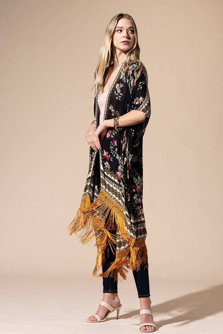 Stunning floral print with ethnic border featuring fine tassel kimono with side slits free size *100% Viscose *APPROX. L 37.50" W 39.5" Fringe L 7.50" 9.49oz *Imported Multicolor Spring Kaftan With Back Tassel Tie-up, Traditional Spring Kaftan With Back Tassel Tie-up, Traditional Kaftan With Back Tassel Tie-up For Spring, Bohemian Long Patterned Kimono, Spring Multicolor Kaftan With Tassels, Long Patterned Festival Kimono, Spring Vacation Bohemian Shawl, Long Patterned Kimono For Festival, Fall Beach Kimono With Tassels