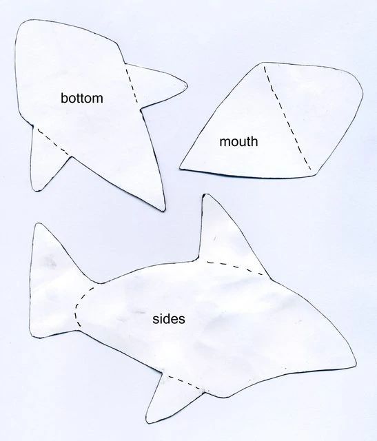 two paper fish cut out to look like they're about to be made into something