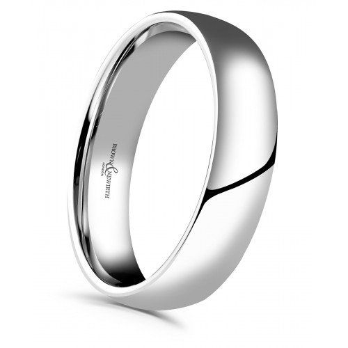 a white gold wedding ring with an elegant design on the outside, and a polished finish