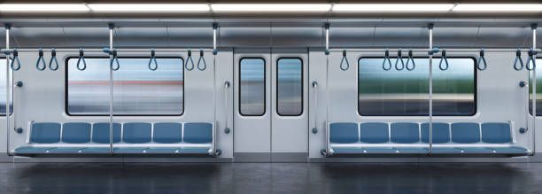 an empty subway car with blue seats and hanging hooks on the doors, viewed from inside