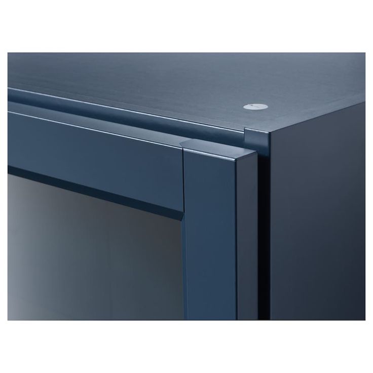 a close up view of the top of a blue cabinet