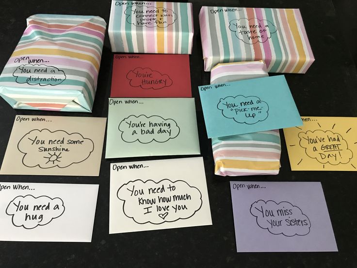 several folded cards with different sayings on them sitting next to each other, one has a thought bubble in the middle