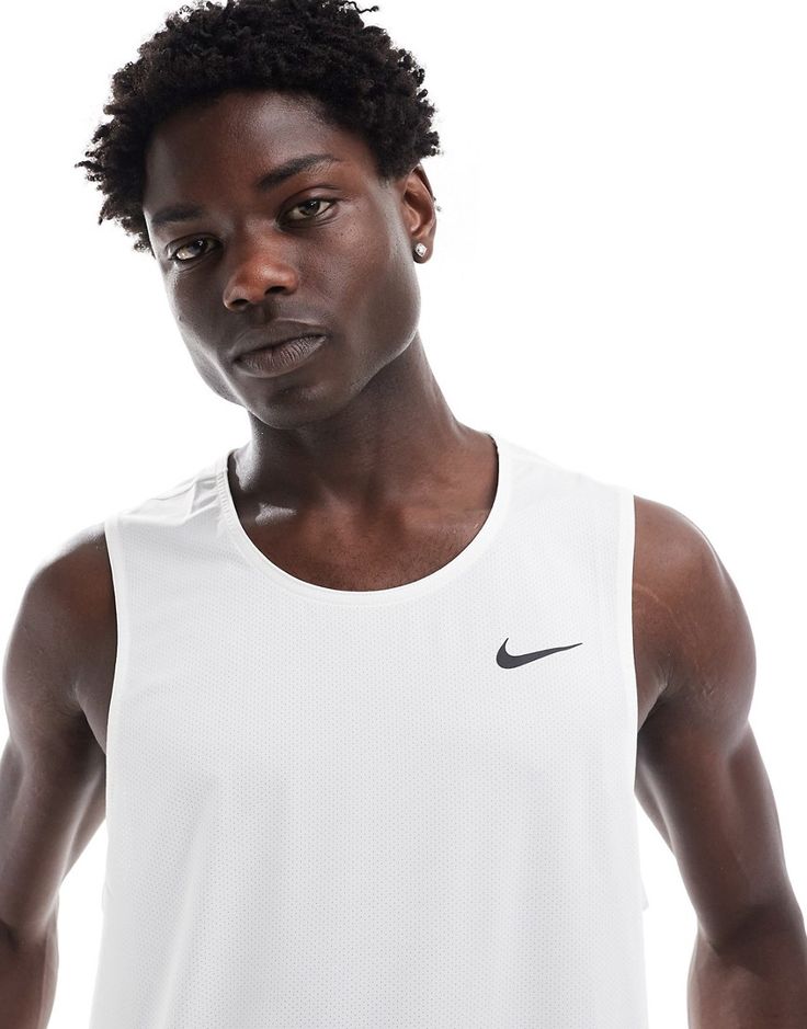 Sportswear by Nike Training Training is now in session Round neck Nike logo print to chest Flatlock seams help reduce friction Relaxed fit Technical White Sweat-resistant Activewear, White Technical Activewear With Medium Support, Functional White Tank Activewear, White Technical Moisture-wicking Activewear, White Breathable Athleisure Tank Top, White Breathable Tank Top Athleisure, White Breathable Tank Top, Athleisure Style, White Breathable Tank Top In Athleisure Style, White Crew Neck Tank Top Athleisure