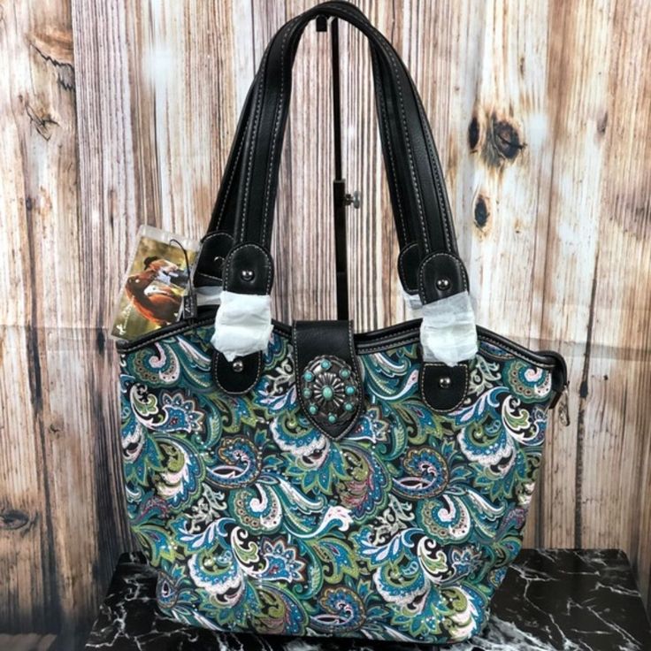 Made Of Cloth Like, Floral Print, Material, This Handbag Has: Turquoise Stone Concho On Flap With Magnetic Button Closure Top Zipper Closure Inside Of Bag Include A Zippered Pocket And 2 Open Pockets Metal Feet On The Bottom For Protection And Stability Double Flat Strap 14.5" X 5" X 11" (Drop 10.5") Shoulder Bag With Snap Closure For Shopping, Double Handle Hobo Bag With Snap Closure For Shopping, Green Satchel Shoulder Bag With Snap Closure, Tote Hobo Bag With Snap Closure For Errands, Hobo Tote Bag With Snap Closure For Errands, Tote Style Hobo Bag With Snap Closure For Errands, Green Shoulder Bag With Snap Closure For Daily Use, Casual Satchel With Snap Closure For Shopping, Casual Bags With Snap Closure For Errands