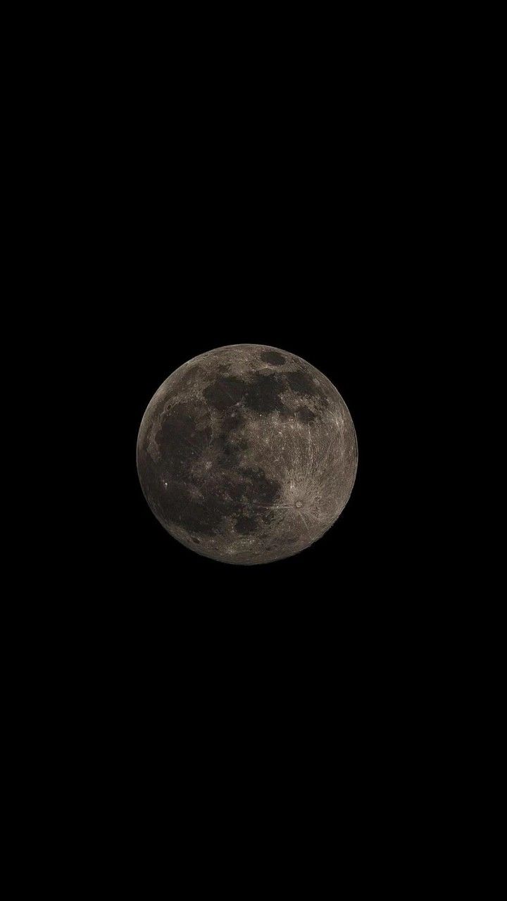 the full moon is seen in the dark sky