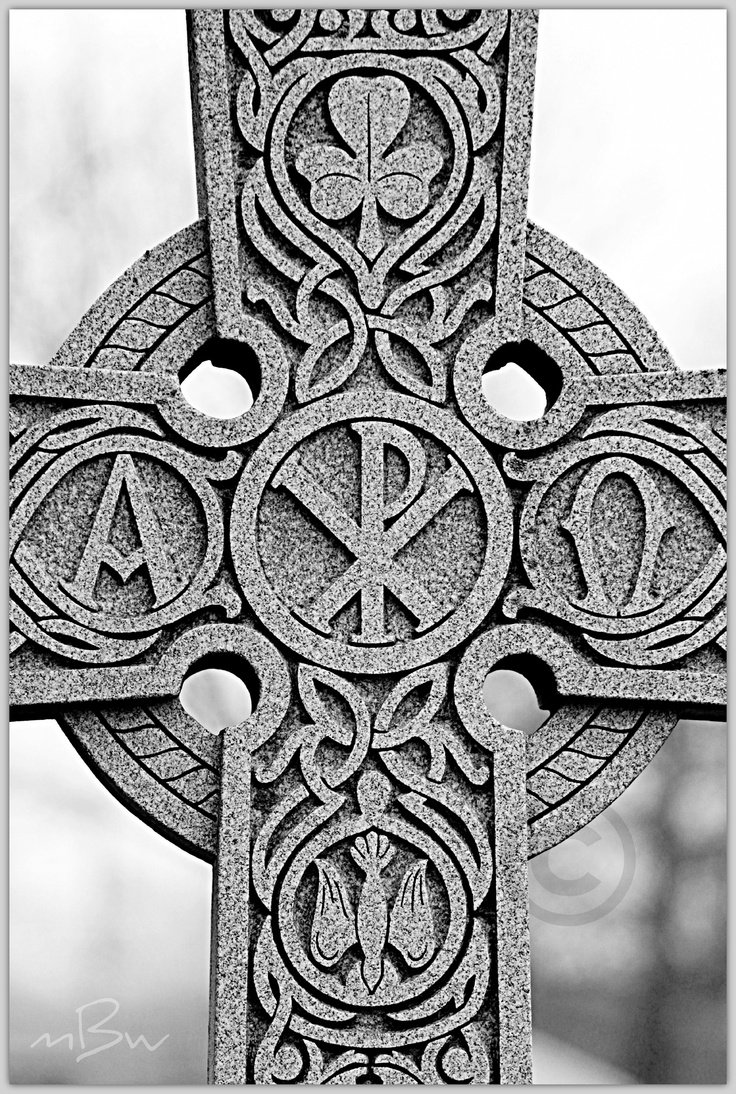 the cross is made up of many different shapes and sizes, including letters on it