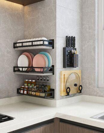 a kitchen counter with plates and utensils on the shelf next to the sink