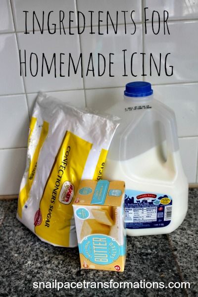 ingredients for homemade icing sitting on a counter top next to a bottle of milk