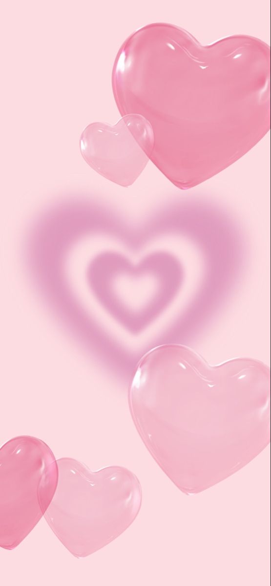 three pink hearts floating in the air