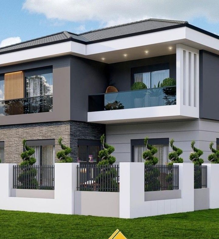 a two story house with balconies on the second floor