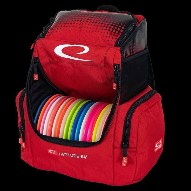 a red backpack filled with frisbees on top of a black background,