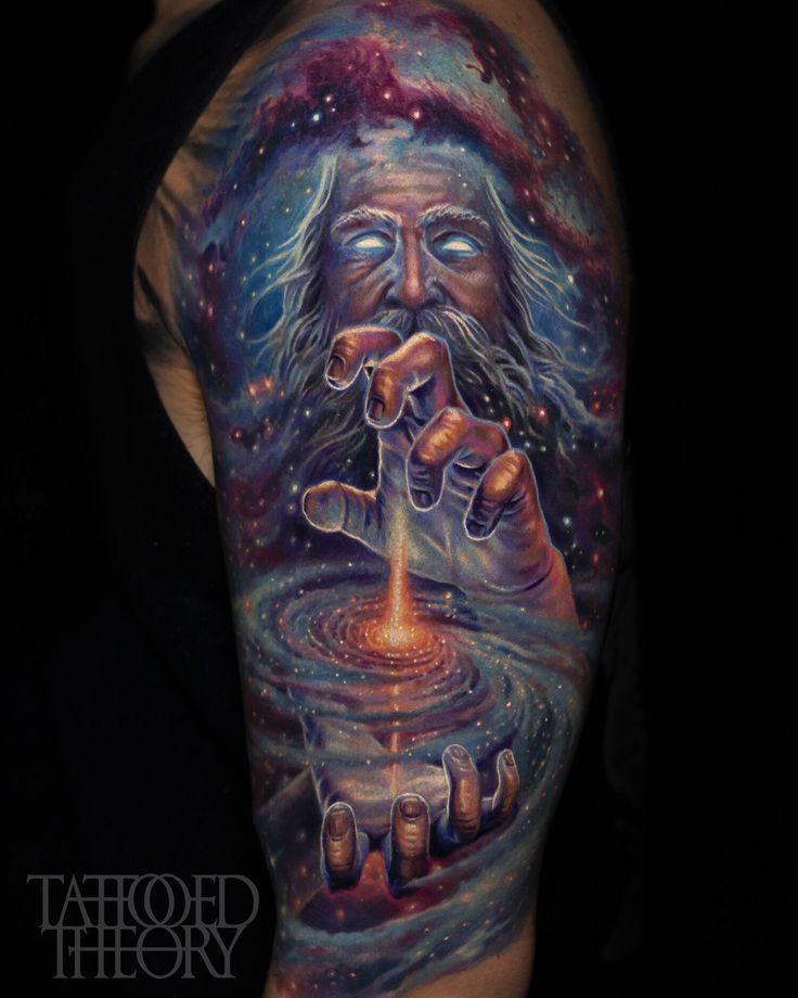 a man's arm with a tattoo on it that has an image of a person holding