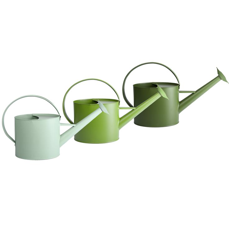 three green and white watering cans, one with a long hose attached to the side