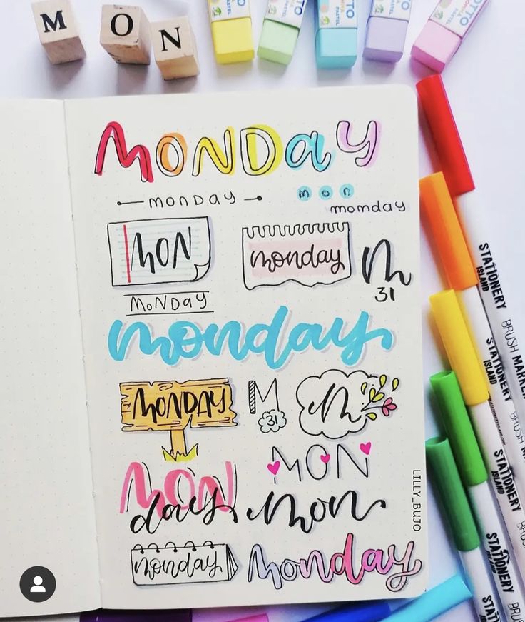 an open notebook with markers and pencils next to it that says monday on the page