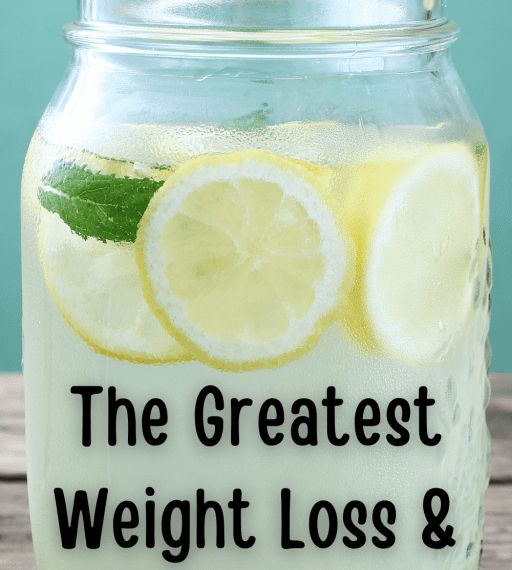 a glass jar filled with lemonade on top of a wooden table