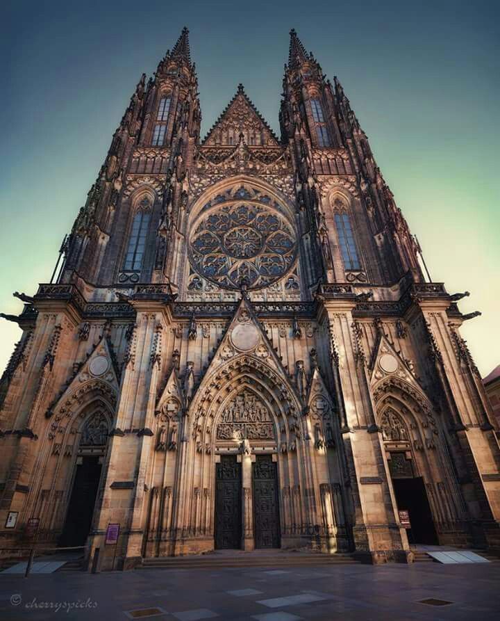 the large cathedral has many windows on it's front side and is very ornate