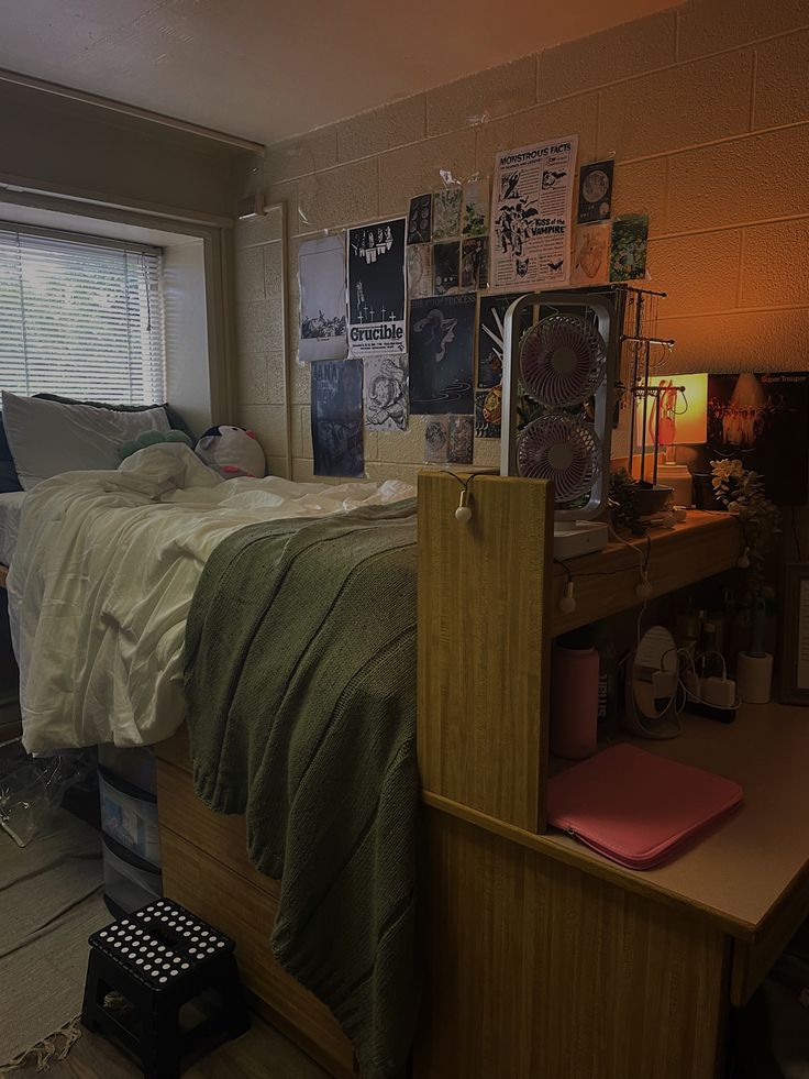 a bed room with a neatly made bed next to a window